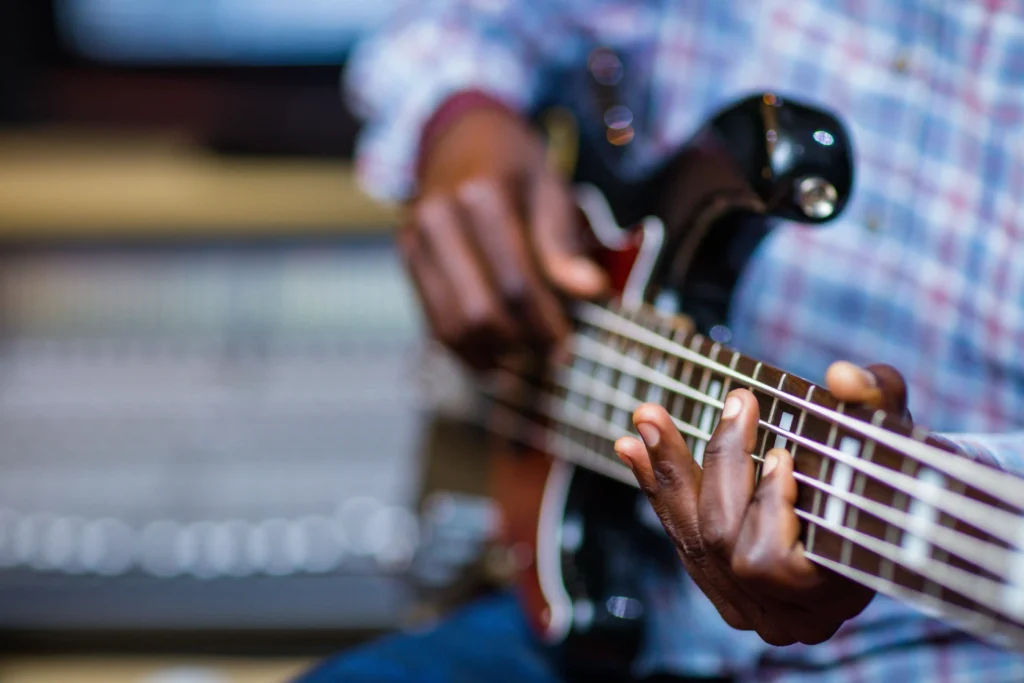 Student developing groove and timing during bass lessons in Singapore